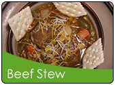 American beef stew in a bowl with saltine crackers